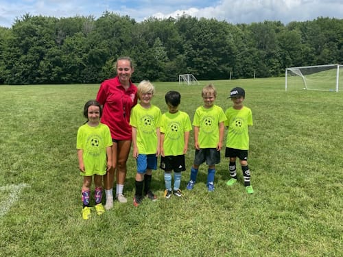 Photo of coach with team
