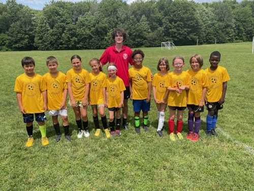 Photo of team with coach