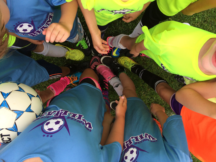 Photo of Soccer Players in huddle